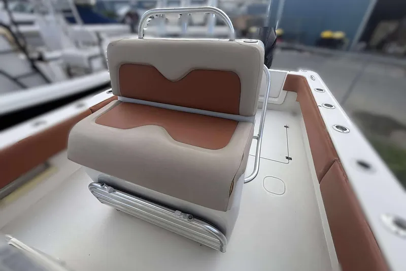  Yacht Photos Pics Andros Offshore 32 boat interior seating, 2013 model, featuring cushioned bench and rod holders.