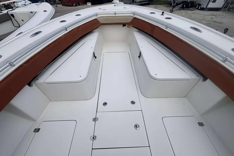  Yacht Photos Pics 2013 Andros Offshore 32 boat interior with white seating and brown trim.
