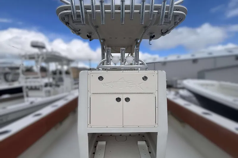  Yacht Photos Pics 2013 Andros Offshore 32 boat console with rod holders, under a blue sky.