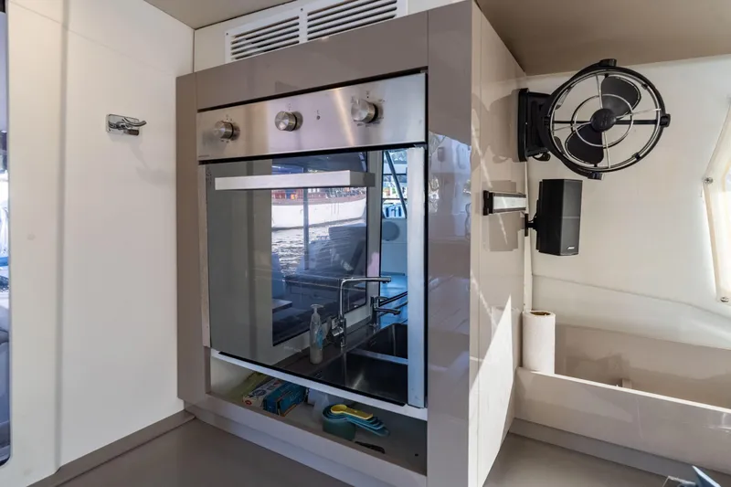 Grand Crew Yacht Photos Pics Modern kitchen area in 2019 Fountaine Pajot 47 yacht with oven and fan.