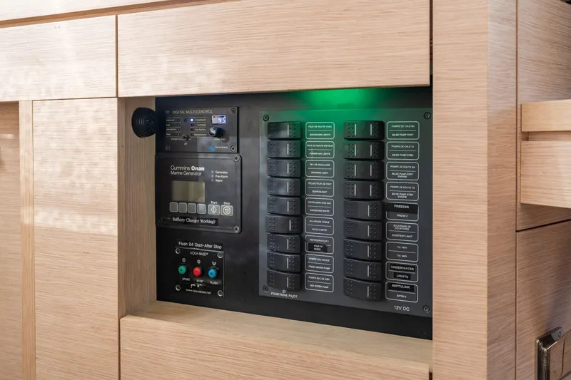 Grand Crew Yacht Photos Pics Control panel of a 2019 Fountaine Pajot 47 yacht, featuring marine generator controls.