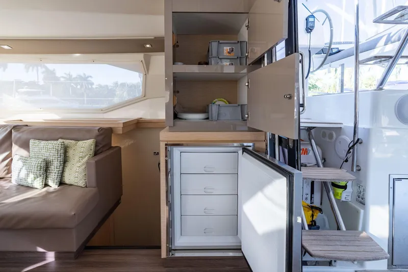 Grand Crew Yacht Photos Pics Interior of 2019 Fountaine Pajot 47 yacht with seating and storage cabinets.