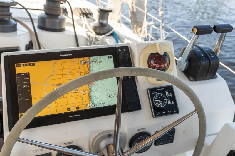 Grand Crew Yacht Photos Pics Cockpit of 2019 Fountaine Pajot 47 catamaran with navigation equipment and steering wheel.