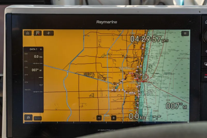 Grand Crew Yacht Photos Pics Navigation display on a 2019 Fountaine Pajot 47, showing coastal map and data.
