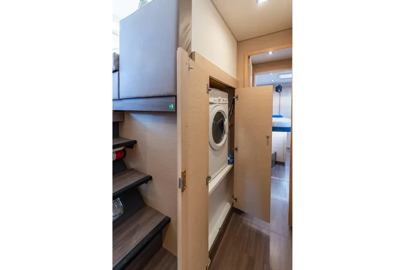 Grand Crew Yacht Photos Pics Laundry area with washer in 2019 Fountaine Pajot 47 yacht interior.