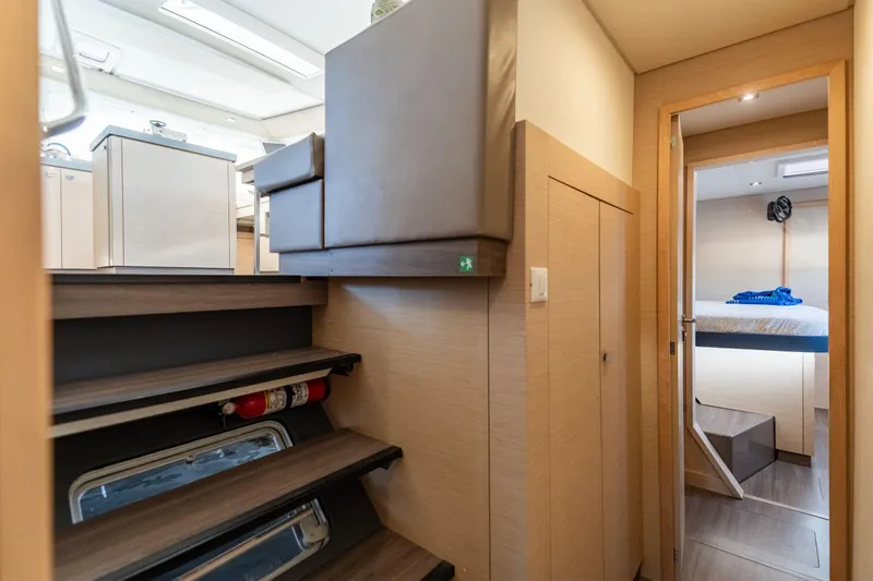 Grand Crew Yacht Photos Pics Interior of 2019 Fountaine Pajot 47 yacht, featuring modern stairs and cozy cabin.