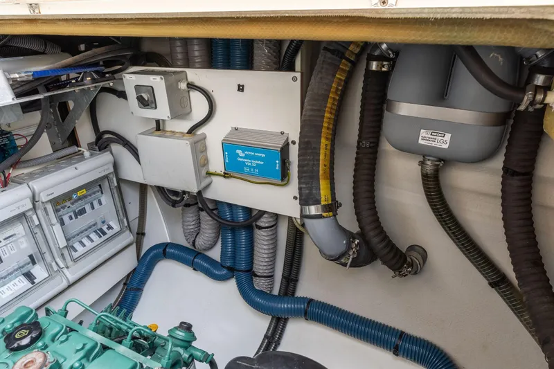 Grand Crew Yacht Photos Pics Engine room of 2019 Fountaine Pajot 47 catamaran with electrical components and wiring.