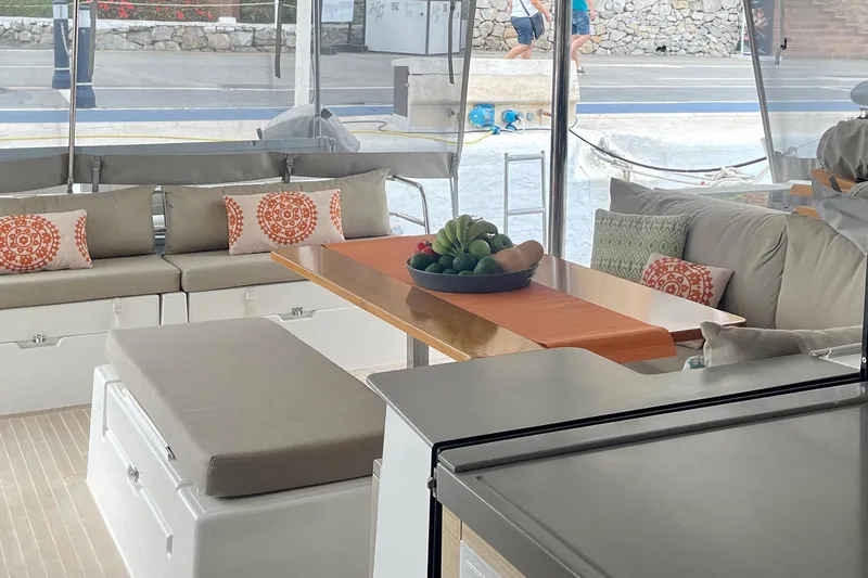 Grand Crew Yacht Photos Pics Luxurious 2019 Saona 47 yacht interior with elegant seating and decorative pillows.