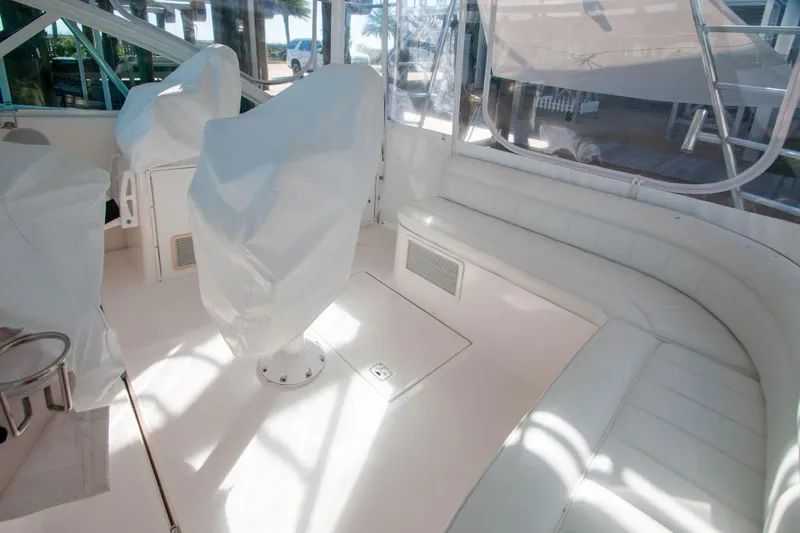 Miss Jayla Yacht Photos Pics 2004 Cabo 40 Express interior with covered seats and white leather seating.