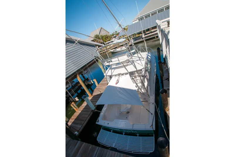 Miss Jayla Yacht Photos Pics 2004 Cabo 40 Express with Seakeeper docked at marina, aerial view.