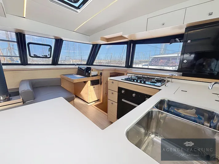 Kaija Yacht Photos Pics Modern Nautitech 46 Open yacht interior with kitchen and seating area, 2022 model.