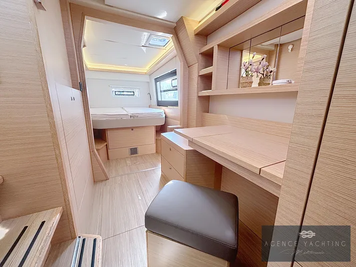 Kaija Yacht Photos Pics Luxurious interior of 2022 Nautitech 46 Open yacht with modern wood finish and cozy seating.