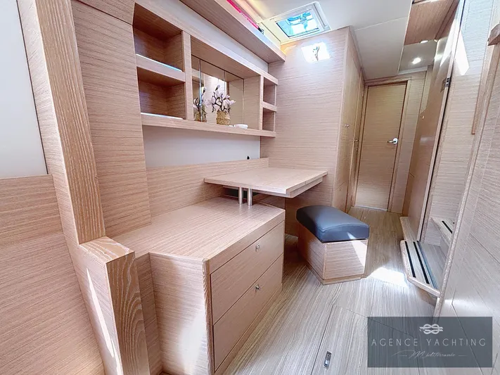 Kaija Yacht Photos Pics Luxurious Nautitech 46 Open 2022 interior with wooden cabinetry and seating.