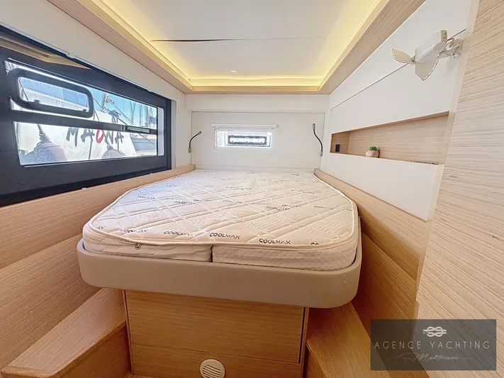 Kaija Yacht Photos Pics Luxurious cabin interior of 2022 Nautitech 46 Open catamaran with modern design and cozy bedding.