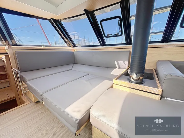 Kaija Yacht Photos Pics Luxurious interior of 2022 Nautitech 46 Open catamaran with modern seating and panoramic windows.