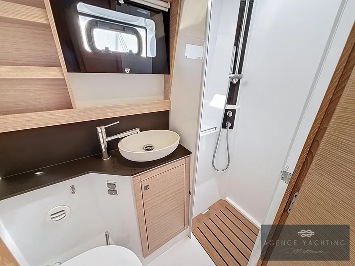 Kaija Yacht Photos Pics Modern bathroom in 2022 Nautitech 46 Open yacht with sleek fixtures and wooden accents.