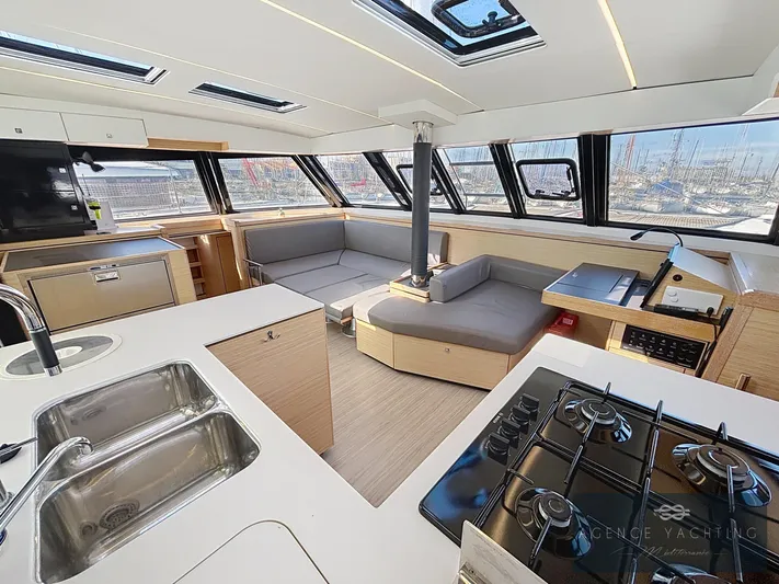 Kaija Yacht Photos Pics Modern interior of 2022 Nautitech 46 Open catamaran with spacious seating and kitchen area.