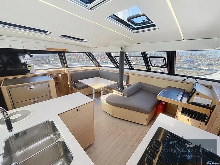 Kaija Yacht Photos Pics Modern interior of 2022 Nautitech 46 Open catamaran with spacious seating and kitchen area.