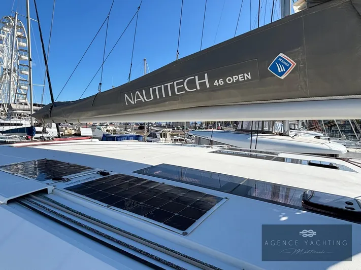 Kaija Yacht Photos Pics 2022 Nautitech 46 Open catamaran with solar panels, docked at marina.