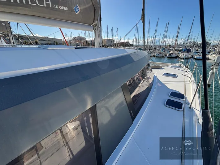 Kaija Yacht Photos Pics 2022 Nautitech 46 Open catamaran docked in a marina, showcasing sleek design and modern features.