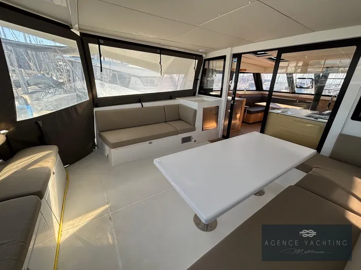 Kaija Yacht Photos Pics Spacious interior of 2022 Nautitech 46 Open catamaran with modern seating and dining area.
