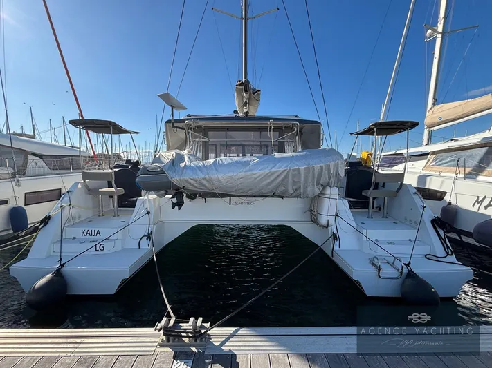 Kaija Yacht Photos Pics 2022 Nautitech 46 Open catamaran docked at marina, rear view.