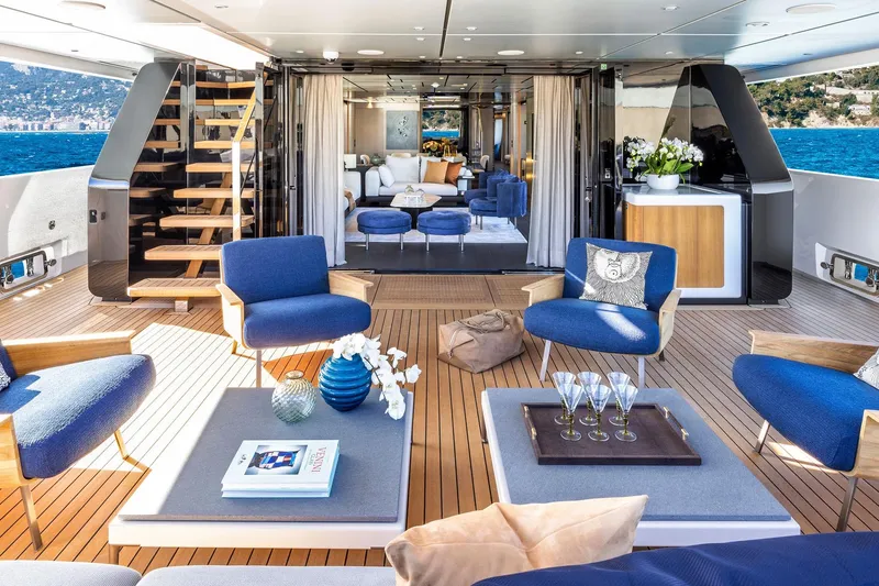  Yacht Photos Pics Luxurious 2022 Custom Line 140' yacht interior with elegant seating and ocean view.
