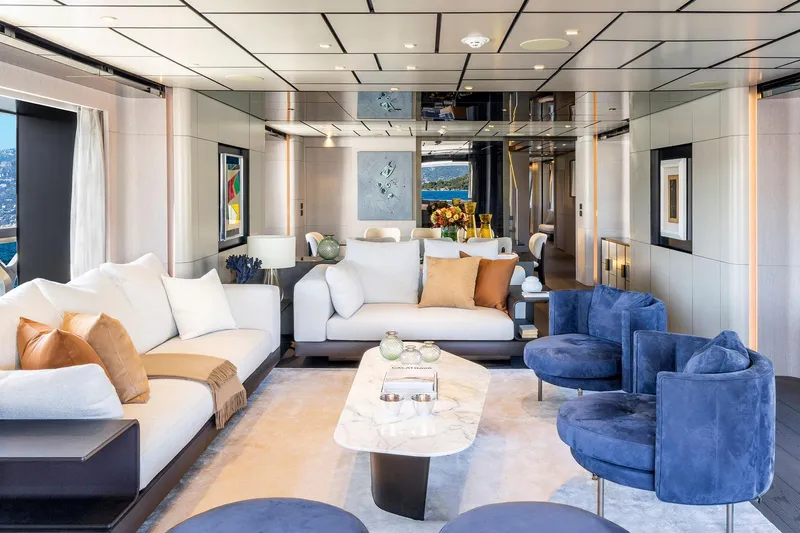 Yacht Photos Pics Luxurious yacht interior with modern decor, featuring plush seating and elegant design, Custom Line 140', 2022.