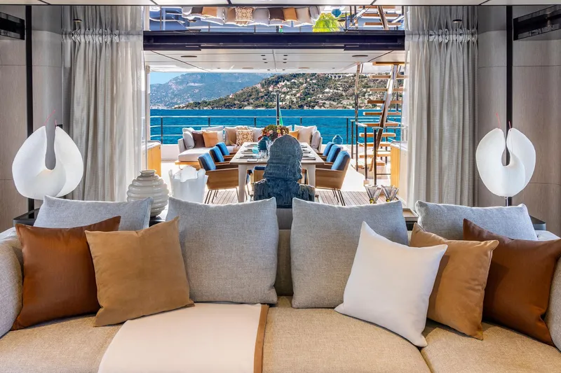  Yacht Photos Pics Luxurious interior of 2022 Custom Line 140' yacht with ocean view and elegant decor.