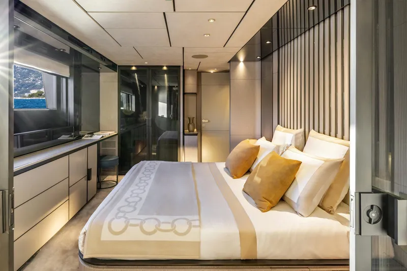  Yacht Photos Pics Luxurious bedroom interior on 2022 Custom Line 140' yacht, featuring elegant design and ocean view.