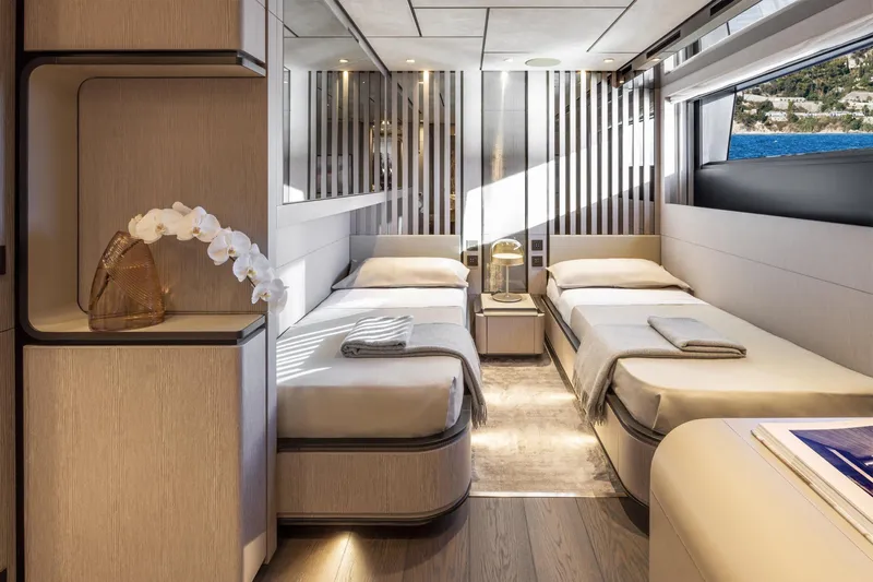  Yacht Photos Pics Luxurious twin bedroom on 2022 Custom Line 140' yacht with elegant decor and sea view.