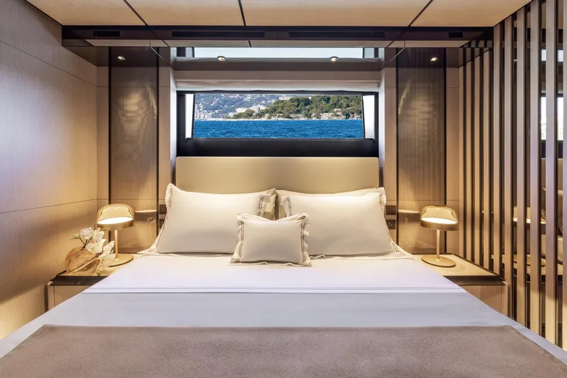  Yacht Photos Pics Luxurious bedroom interior on 2022 Custom Line 140' yacht with ocean view.