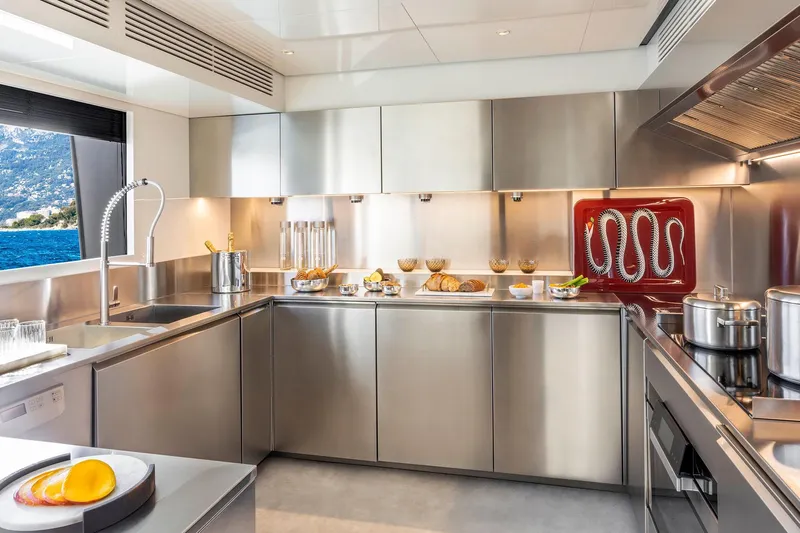  Yacht Photos Pics Luxurious stainless steel yacht kitchen with modern appliances, Custom Line 140', 2022 model.