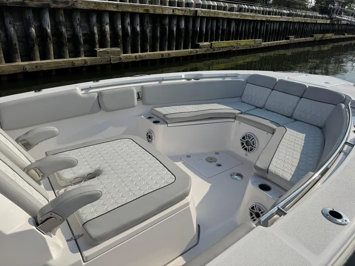 O4 Yacht Photos Pics 2022 Sea Fox 328 Commander boat interior with cushioned seating and speakers.