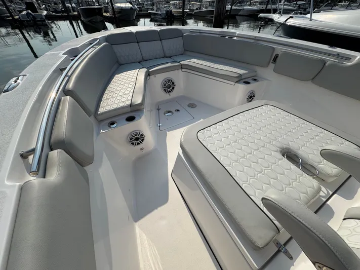 O4 Yacht Photos Pics 2022 Sea Fox 328 Commander boat interior with cushioned seating and speakers.