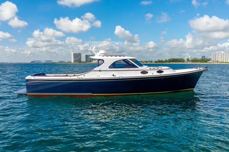 Volatility Yacht Photos Pics San Juan SJ 38 yacht, 2003 model, cruising on clear blue waters under a sunny sky.
