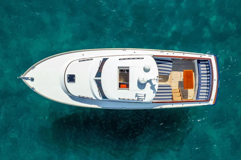 Volatility Yacht Photos Pics Aerial view of 2003 San Juan SJ 38 boat on clear turquoise water.