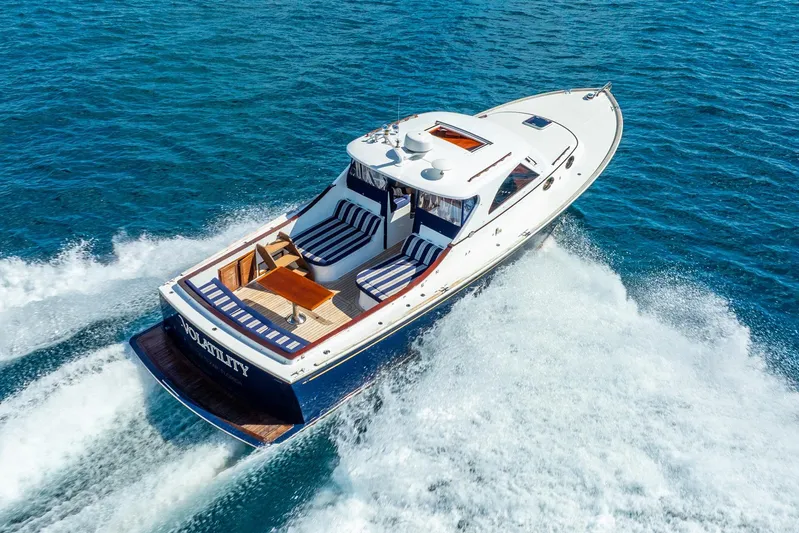 Volatility Yacht Photos Pics Luxury San Juan SJ 38 yacht cruising on open water, 2003 model, aerial view.