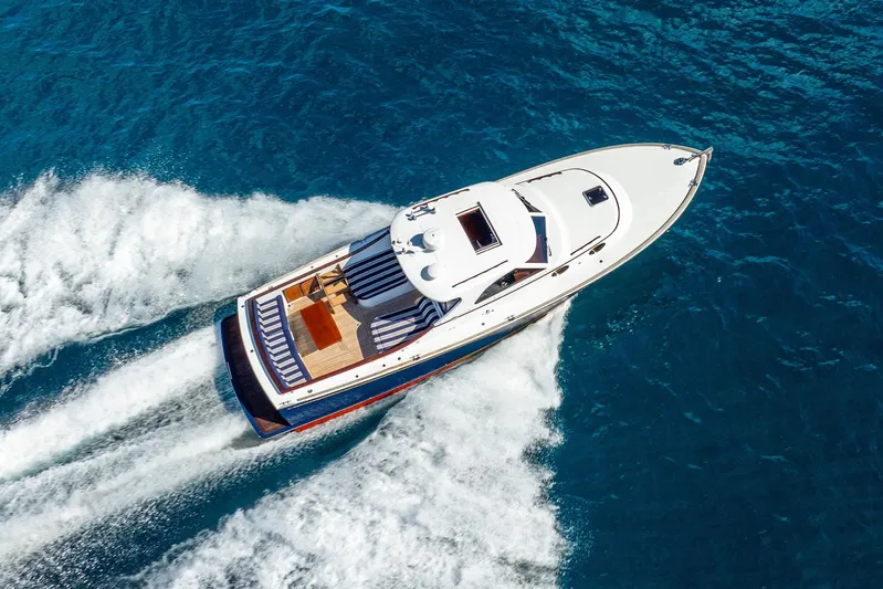 Volatility Yacht Photos Pics Aerial view of 2003 San Juan SJ 38 yacht cruising on blue ocean waters.