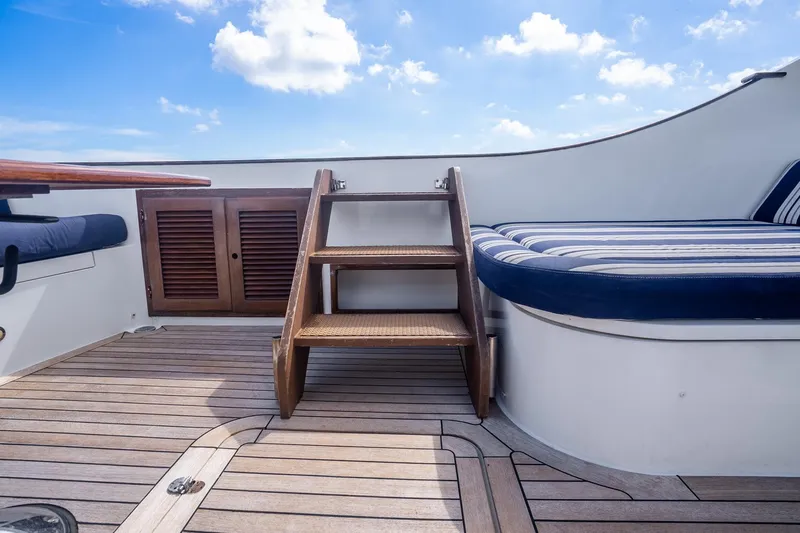 Volatility Yacht Photos Pics Deck of 2003 San Juan SJ 38 yacht with wooden steps and striped seating.