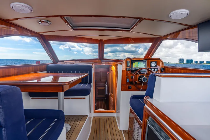 Volatility Yacht Photos Pics Interior of 2003 San Juan SJ 38 yacht with wooden finishes and ocean view.