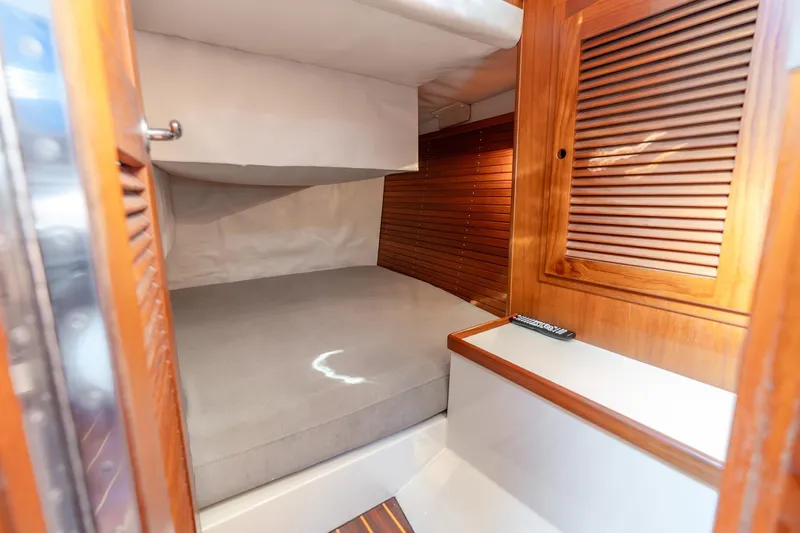 Volatility Yacht Photos Pics Cozy cabin interior of 2003 San Juan SJ 38 boat with wooden accents.