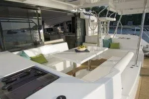 Isola Yacht Photos Pics 2018 Leopard 40 yacht interior with modern seating and dining area.