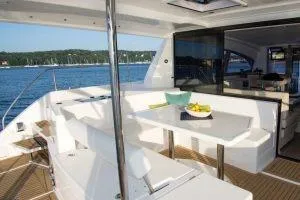 Isola Yacht Photos Pics 2018 Leopard 40 yacht interior with dining area overlooking the water.