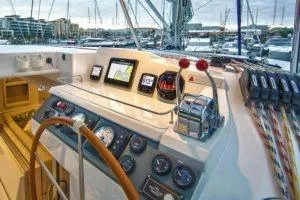 Isola Yacht Photos Pics 2018 Leopard 40 yacht cockpit with navigation instruments and steering wheel in marina.