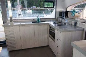 Isola Yacht Photos Pics Modern kitchen interior of 2018 Leopard 40 catamaran with sleek countertops and appliances.