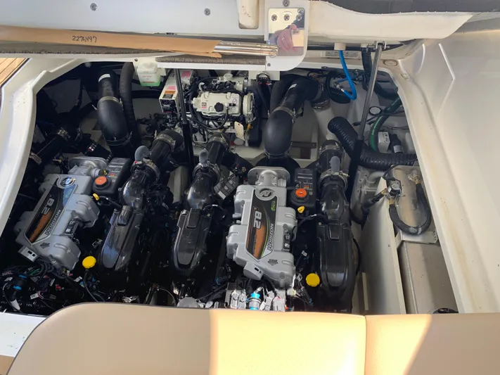 Lady Faby Yacht Photos Pics Engine compartment of 2019 Sea Ray Sundancer 350, showcasing multiple powerful engines.