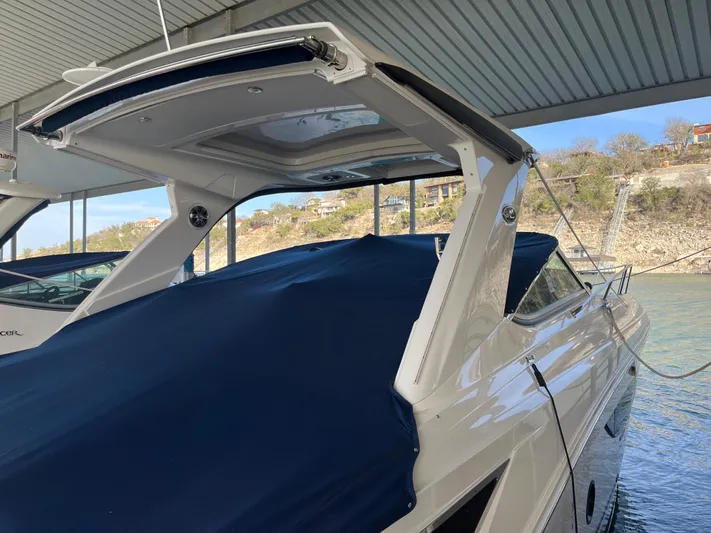 Lady Faby Yacht Photos Pics 2019 Sea Ray Sundancer 350 docked under a covered marina.