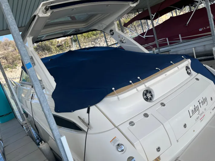 Lady Faby Yacht Photos Pics 2019 Sea Ray Sundancer 350 yacht docked, covered with a blue tarp.