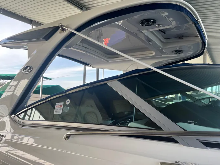 Lady Faby Yacht Photos Pics 2019 Sea Ray Sundancer 350 yacht under a covered dock, showcasing sleek design and modern features.